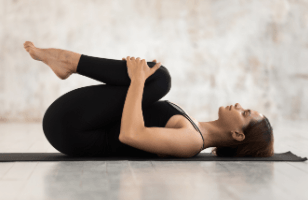 young-smiling-attractive-woman-ardha-matsyendrasana-pose-whi